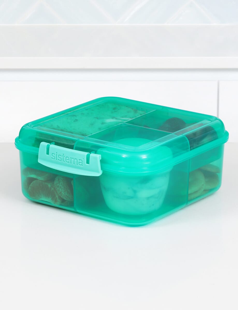 https://stergita.sirv.com/sistema/catalog/product/4/1/41685_1.25l_lunch_bentocube_lifestyle_bench_food_closed_teal.png?canvas.color=fcfbf8